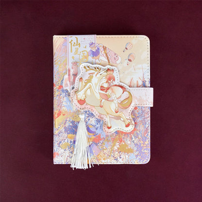 Magic World Leather Journal with colorful pages, magnetic buckle, and whimsical cover art featuring a fantasy scene.