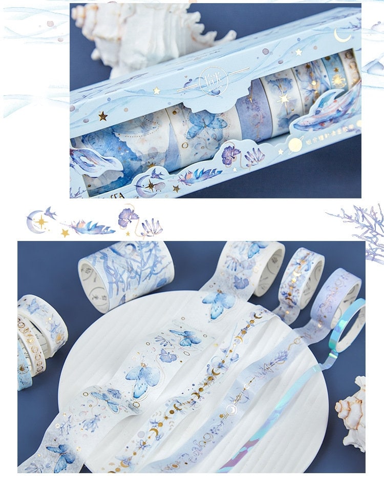 Anime Washi Tape Set - 8 Rolls for Crafting with ocean and wave designs, various patterns in shades of blue and white, displayed in an attractive box with gold accents.