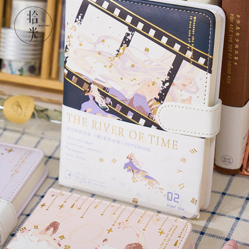 The River of Time Leather Journal with Magnetic Buckle, featuring a whimsical time-themed design with vibrant illustrations and gold accents, perfect for writing and journaling.