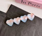 Acrylic resin heart snap clips for girls, iridescent finish, perfect for back to school, kawaii hair accessories for kids.