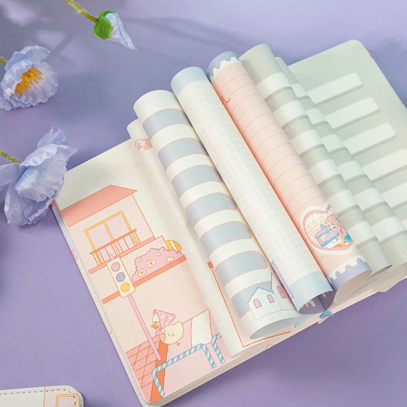 Magnetic Buckle Leather Journal with Capture Summer Design, featuring lined, grid, and illustrated pages in pastel colors, open on a lavender background with purple flowers.