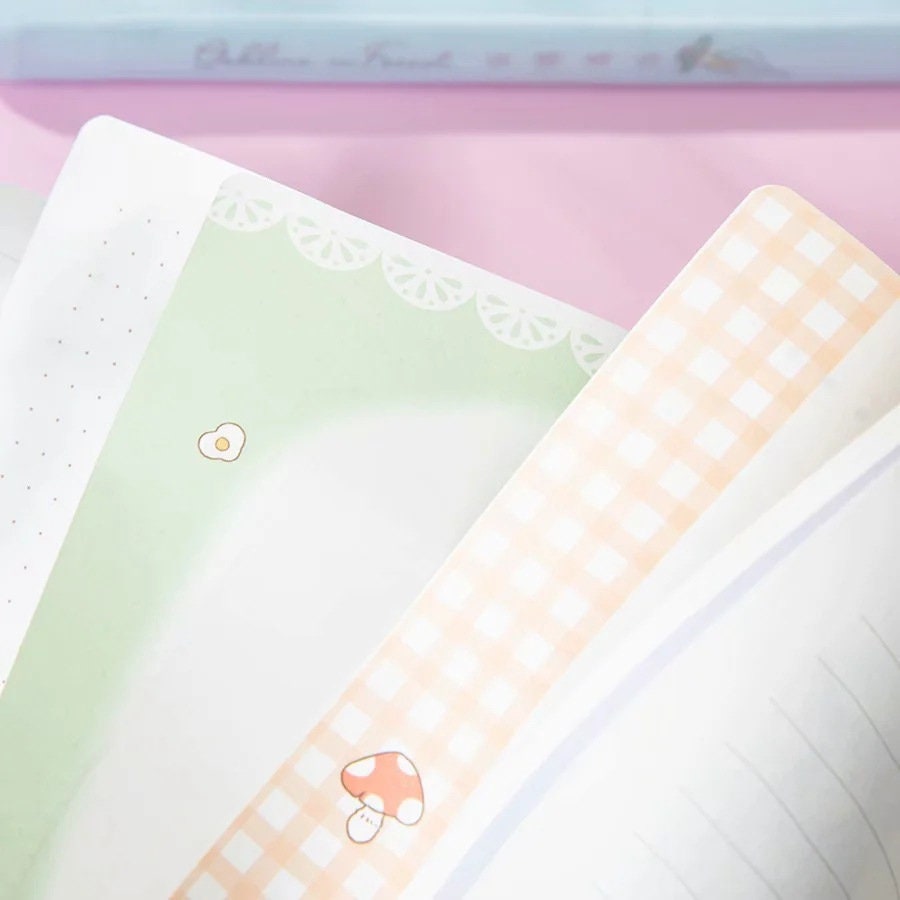 Gollina Forest Notebook - Magnetic Buckle Kawaii Journal with cute mushroom and egg illustrations on pastel-colored pages, featuring dotted, checkered, and lined designs. Perfect for kawaii stationery lovers.