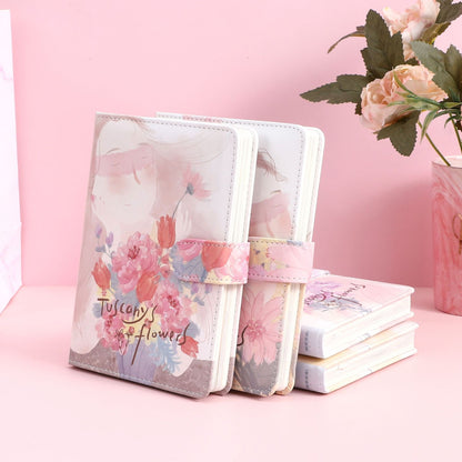 Tuscany's Flowers Leather Journal with Magnetic Buckle featuring a pastel floral design and a serene face illustration, perfect for writing and note-taking.