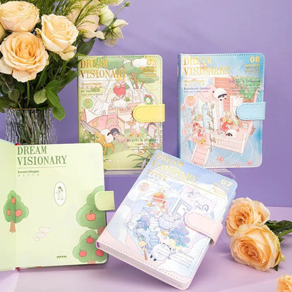 Dream Visionary Magnetic Buckle Leather Journal in assorted pastel colors with whimsical illustrations, displayed with roses in a vase on a purple background.