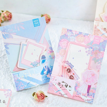 Picnic Notepad with 30 sticky notes for journals in pastel blue and pink with floral designs, kawaii style, perfect for note-taking and journaling.