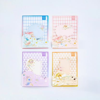 Picnic Notepad - 30 Sticky Notes for Journals in four pastel colors: blue, pink, purple, and orange with whimsical illustrations and golden accents.