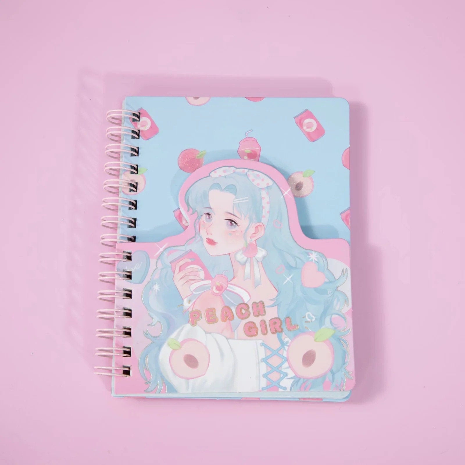 Kawaii Peach Girl Winding Journal with 180 colorful pages, featuring a cute pastel design with a girl holding a peach drink and surrounded by peach-themed illustrations.