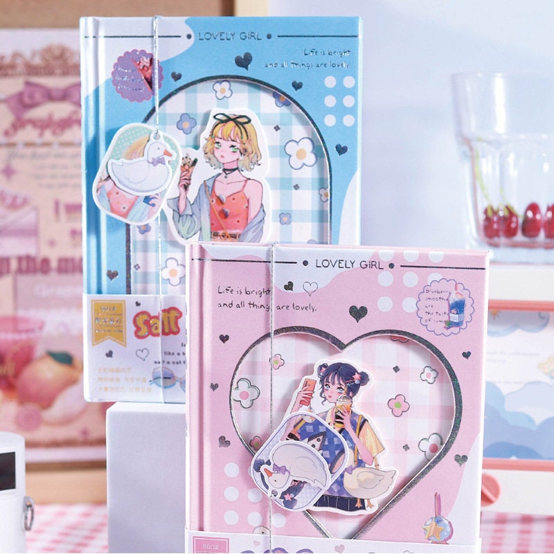 Magnetic Buckle Kawaii Anime Girl Journal with pastel blue and pink covers, featuring cute anime girl illustrations and charming heart and floral designs, perfect for kawaii stationery enthusiasts.