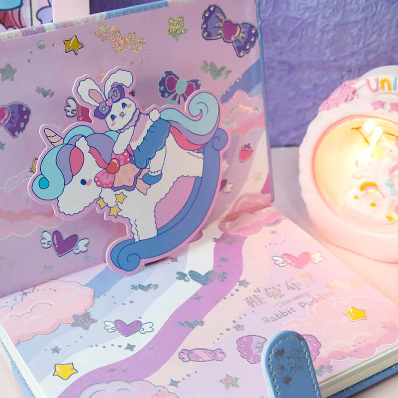 Rabbit Pudding Leather Journal with Magnetic Buckle featuring a kawaii design of a rabbit riding a unicorn, with pastel colors, glitter accents, and cute bow illustrations.