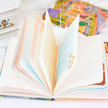 Magnetic Buckle Leather Journal - Cloud Town Design with pastel-colored pages featuring cute illustrations, ideal for note-taking and artistic journaling.