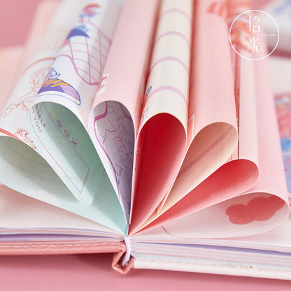 Close-up of the Kawaii Harajuku Leather Journal in A5 size with a magnetic buckle, showcasing its adorable pink and pastel-colored pages adorned with cute, whimsical designs.