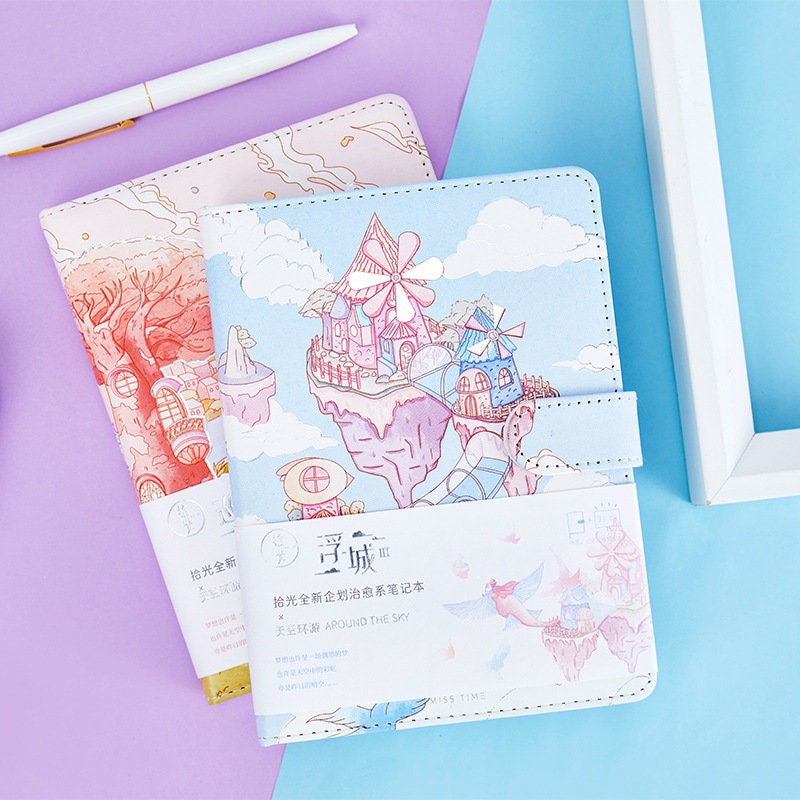 Magnetic Buckle Leather Journal - Around the Sky Design featuring whimsical sky castles and pastel colors, perfect for cute stationary lovers.