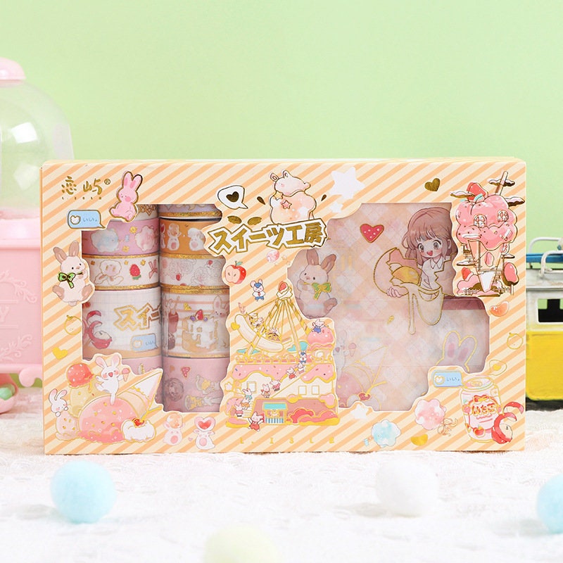 Anime Girl Washi Tape Set - 10 Rolls and Stickers featuring cute pastel designs with characters, animals, and desserts in a decorative packaging.