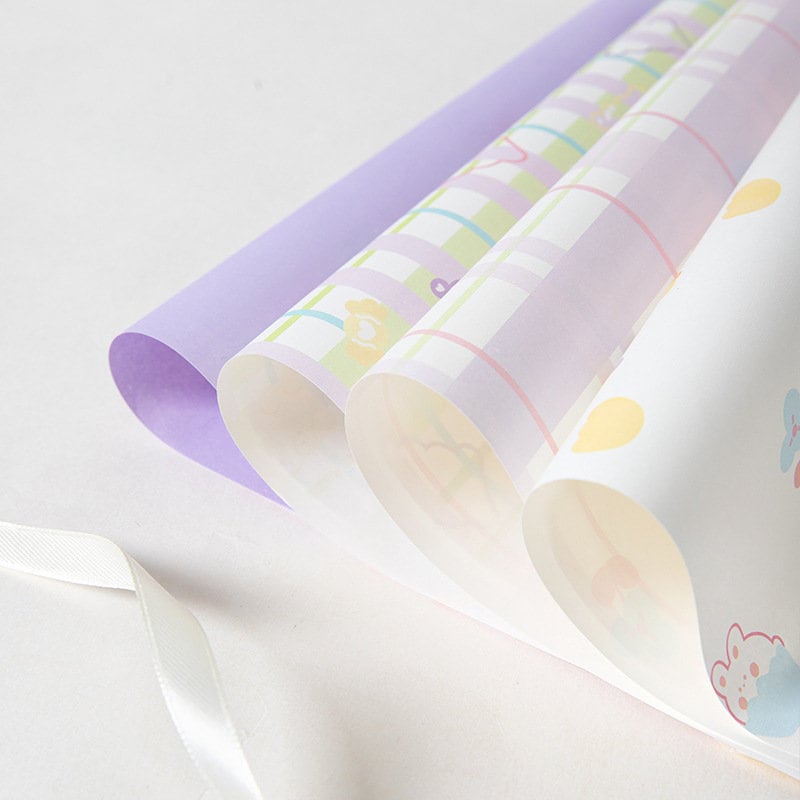 Kawaii pastel gift wrapping paper with cute designs - set of 6 sheets, ideal for wrapping presents in charming and colorful style.