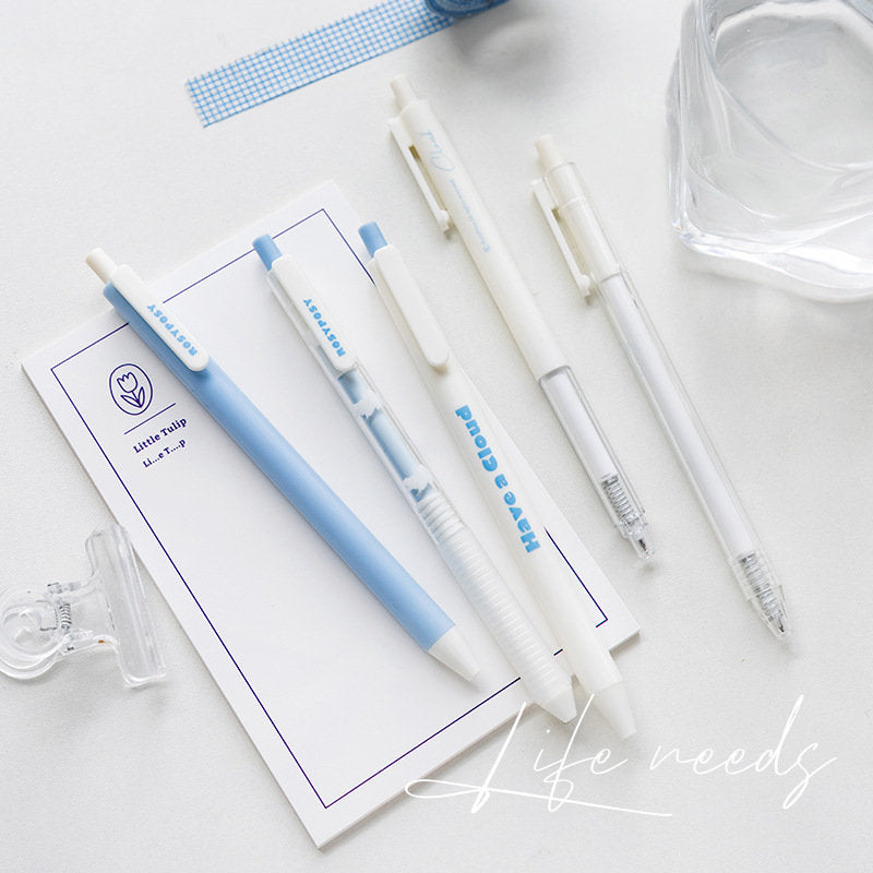 Pastel quick-dry gel pens with black ink, pack of 5 lying on a white notepad. Each pen has a pastel blue and white design, perfect for kawaii stationery lovers.