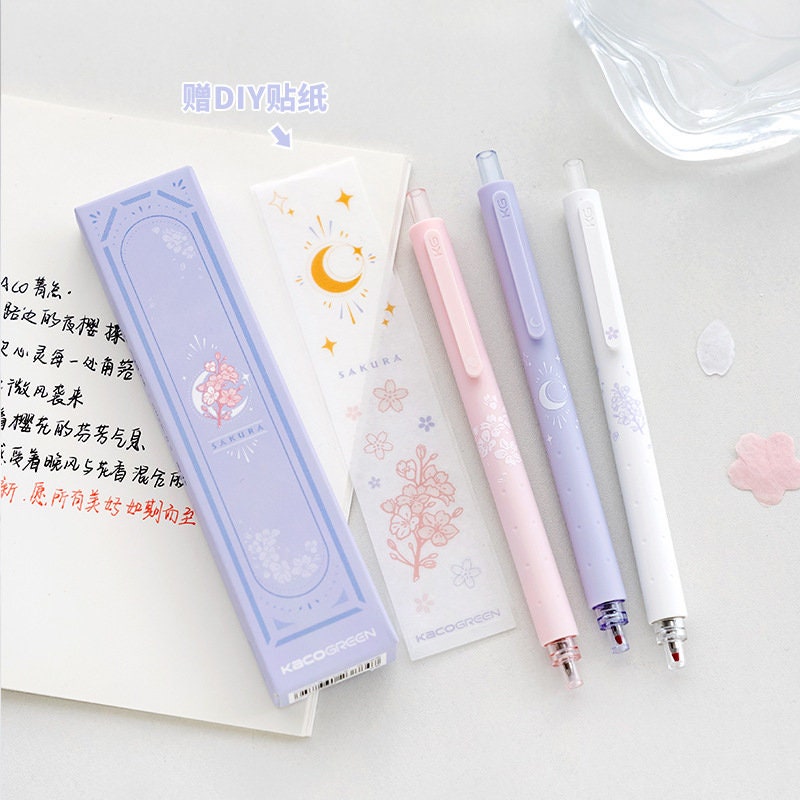 Kawaii Quick-Dry Dual Color Micro Pen in pastel colors with floral and moon designs, DIY sticker set, sakura-themed stationery, cute and stylish writing tools.