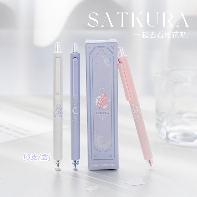 Kawaii Quick-Dry Dual Color Micro Pen in pastel pink, purple, and blue, with delicate floral designs, displayed with elegant packaging. Ideal for journaling and note-taking.