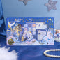 Falling Stars Decorative Sticky Notepad Set in celestial-themed packaging with dreamy blue and gold accents, featuring various sticky notes and a notepad with star and moon designs.