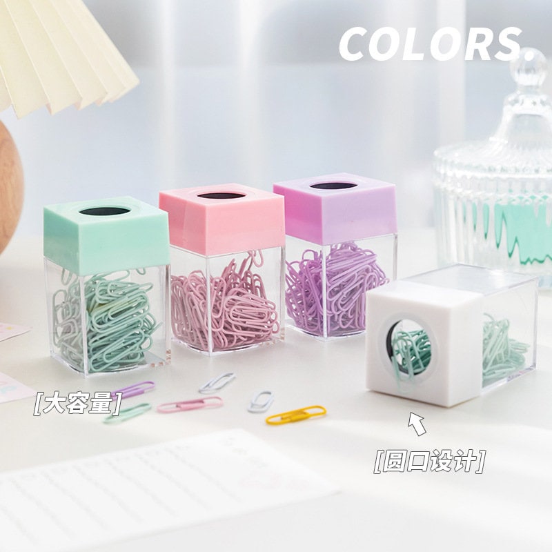 Pastel office paper clips in colorful containers for journals and books, featuring mint green, pink, and lavender hues, perfect for organizing documents and adding a kawaii touch to your workspace.