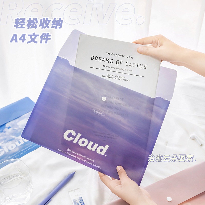 Portable A4 File Folder with Button Closure in purple cloud design, holding a document, with a hand placing a file inside.