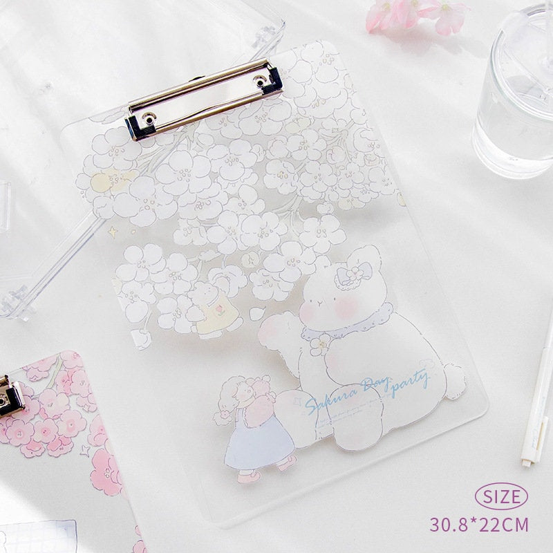 Sakura animal design clipboard with cute teddy bear and sheep illustrations, sturdy plastic, size 30.8 x 22 cm, kawaii stationery accessory.